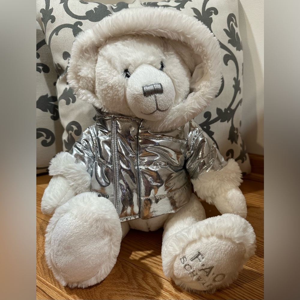 - FAO Schwarz Bear Silver Shiny Puff Jacket. Approx. 13".